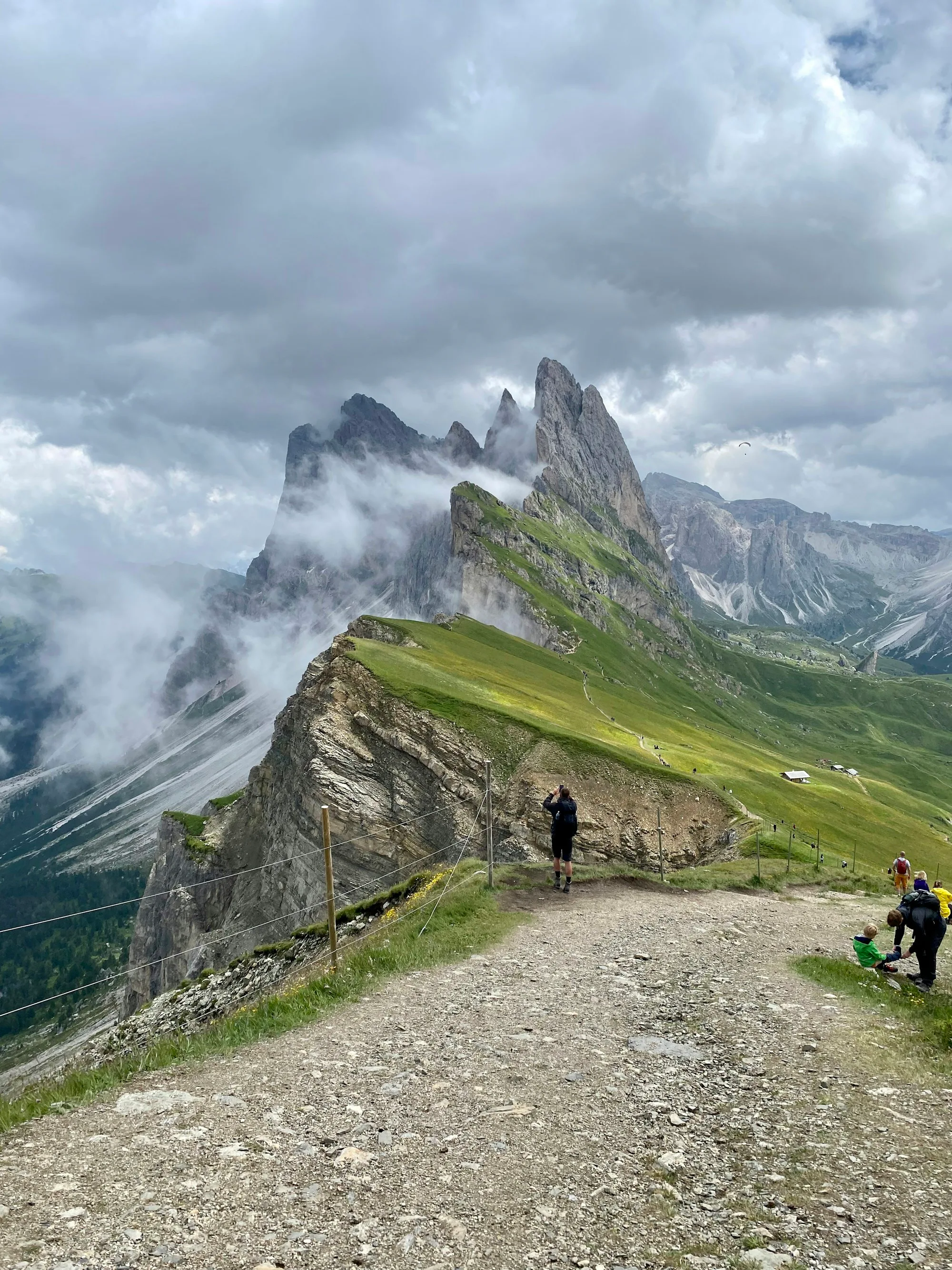 Two people standing on top of a mountain