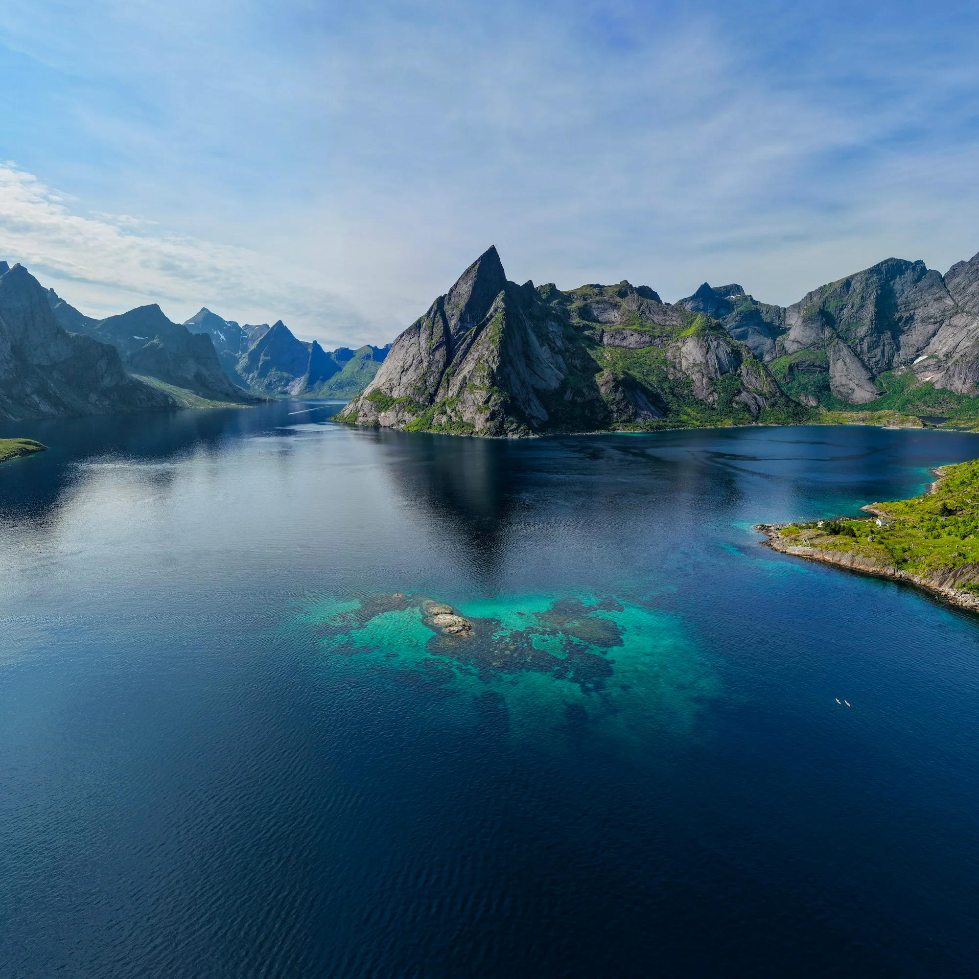 The Reine fjord surrounded by steep mountains and clear water