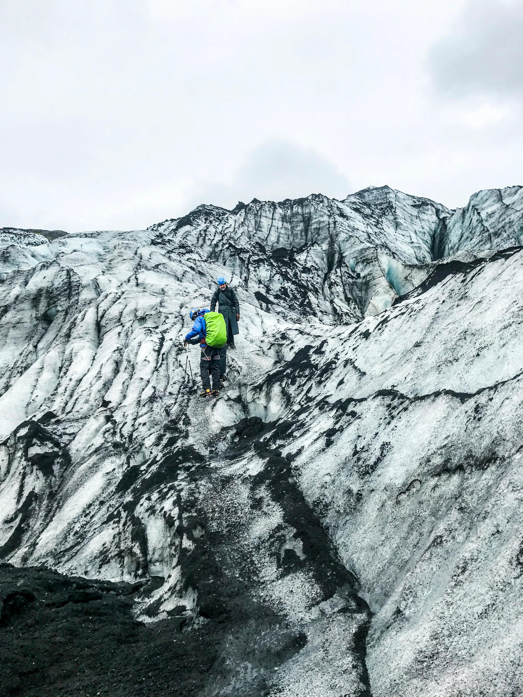 A roped hiker crossing a crevassed glacier